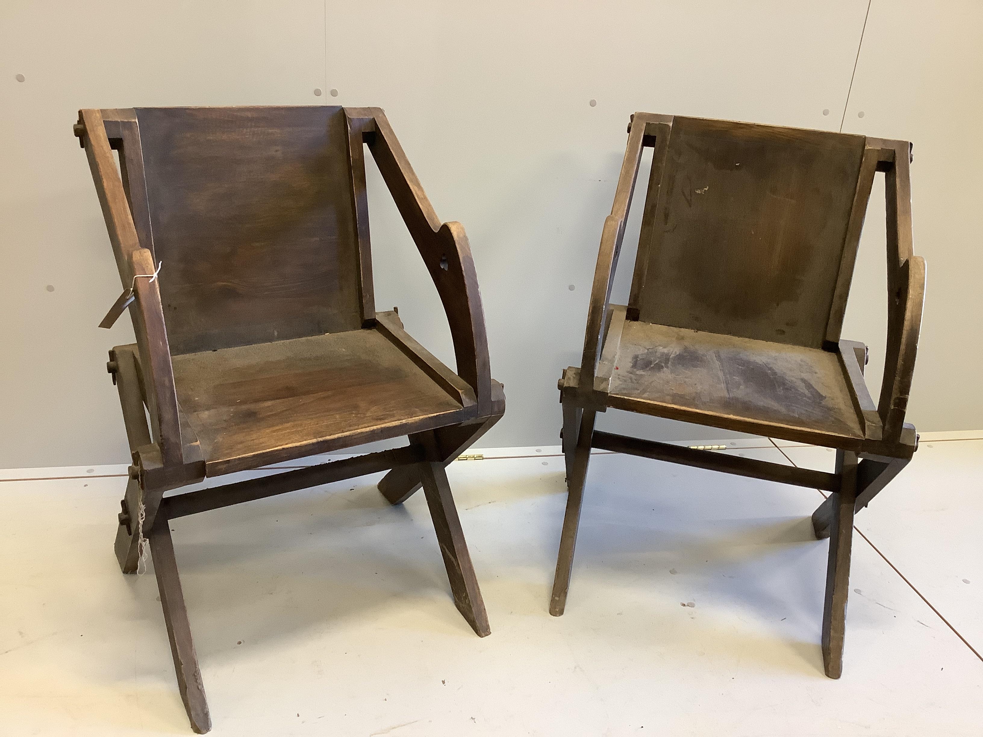 A pair of stained beech Glastonbury type chairs, width 63cm, depth 55cm, height 89cm